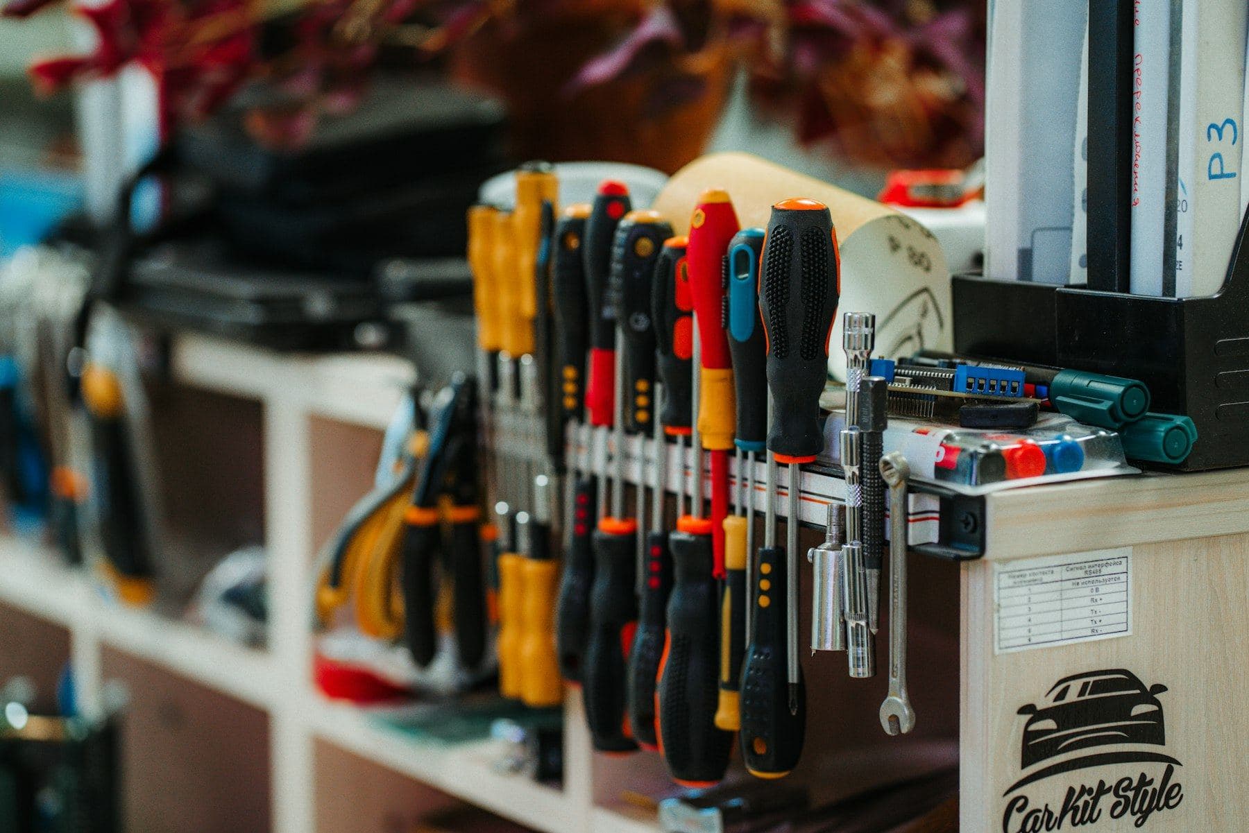 A technician's tool bag with hand tools
